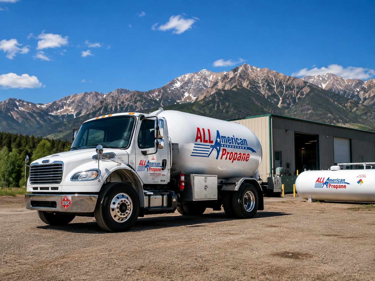 all american propane tank and bobtail in front of a workshop with a mountain view